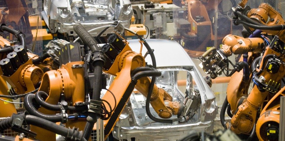 Photograph of robots assembling automobiles