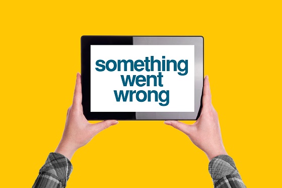 Something Went Wrong Message on Digital Tablet Computer Display, Woman Holding Device, Isolated on Yellow Background